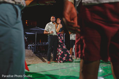 Indian bride and groom at their sangeet dance floor. Indian bride and groom at their sangeet dance floor.