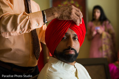 Indian groom getting turban on. Indian groom getting turban on.