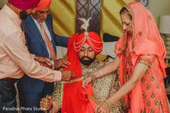 Indian groom getting his dupatta. Indian groom getting his dupatta.