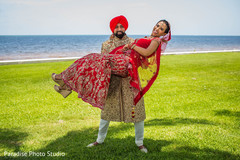 Lovely Indian couple on their ceremony wedding outfits. Lovely Indian couple on their ceremony wedding outfits.