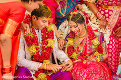 Sweet Indian couple exchanging rings. Sweet Indian couple exchanging rings.