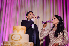 Indian bride and groom having their drinks. Indian bride and groom having their drinks.