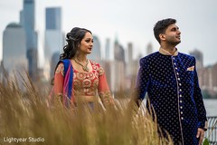 Indian bride holding the raja's hand during the photo shoot Indian bride holding the raja's hand during the photo shoot