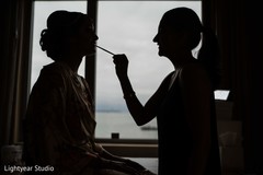 Maharani being assisted by makeup artist Maharani being assisted by makeup artist