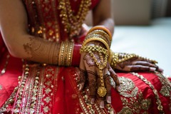 Close up details of the mehndi design and bridal jewelry Close up details of the mehndi design and bridal jewelry