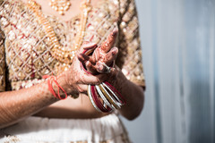 Indian bride putting on her bangles Indian bride putting on her bangles