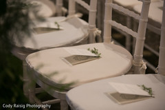 Invitations on the guest's chairs at the Indian wedding Invitations on the guest's chairs at the Indian wedding