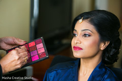 Lovely bride getting her makeup done Lovely bride getting her makeup done