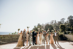 Cheerful bridesmaids and groomsmen during photo shoot Cheerful bridesmaids and groomsmen during photo shoot