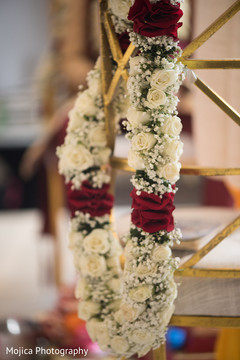 Flower garland details at the Indian wedding venue Flower garland details at the Indian wedding venue