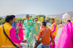 Cheerful guests dancing along the dhol Cheerful guests dancing along the dhol