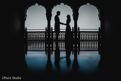 Indian bride and groom holding hands for pictures Indian bride and groom holding hands for pictures