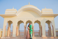 Indian bride and groom outdoors by the venue Indian bride and groom outdoors by the venue