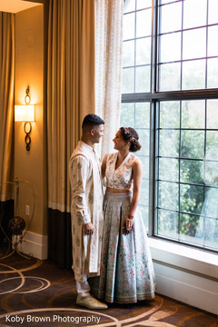 Gorgeous Indian bride and groom posing by the window. Gorgeous Indian bride and groom posing by the window.