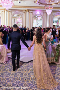 Indian newlyweds making their entrance to wedding reception. Indian newlyweds making their entrance to wedding reception.
