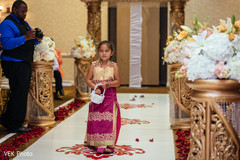 Lovely kid guest making her entrance to the ceremony Lovely kid guest making her entrance to the ceremony