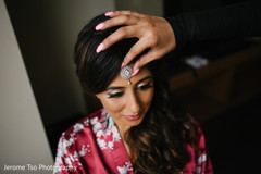 Maharani being assisted with the tikka Maharani being assisted with the tikka