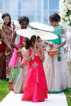 Lovely flower girls walking in to announce the bride is coming. Lovely flower girls walking in to announce the bride is coming.