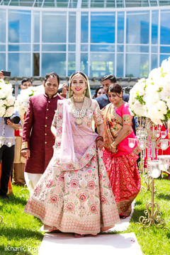 Glamorous Indian bride walking in to ceremony. Glamorous Indian bride walking in to ceremony.