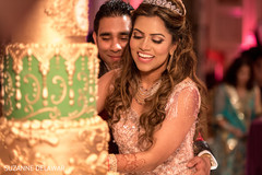Indian couple cutting their wedding cake Indian couple cutting their wedding cake