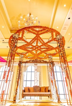 Beautiful jhula under floral mandap Beautiful jhula under floral mandap