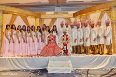 Indian newlyweds with their bridal party Indian newlyweds with their bridal party