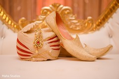 Close up capture of pagri and shoes to be used by Raja Close up capture of pagri and shoes to be used by Raja