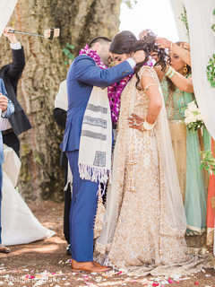 Indian groom placing a mangamalai to bride during wedding ceremony. Indian groom placing a mangamalai to bride during wedding ceremony.
