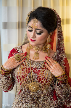 Indian bride showing her lovely jewelry set Indian bride showing her lovely jewelry set