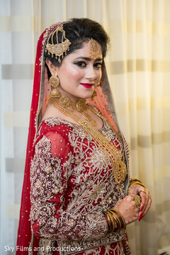 Indian bride glowing in her wedding attire. Indian bride glowing in her wedding attire.