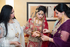 Indian bride getting ready with her close ones Indian bride getting ready with her close ones