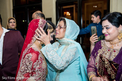 Indian bride saying goodbye to her family Indian bride saying goodbye to her family