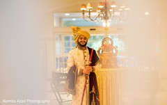 Raja holding the kirpan as he prepares for the ceremony Raja holding the kirpan as he prepares for the ceremony