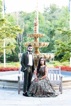 Amazing shot of Indian newlyweds by the fountain Amazing shot of Indian newlyweds by the fountain