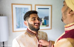 Lovely moment of groom and best man as they prepare Lovely moment of groom and best man as they prepare