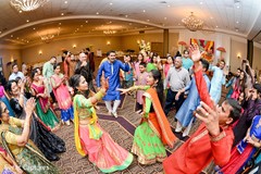 Upbeet indian bride and groom at their garba dance. Upbeet indian bride and groom at their garba dance.