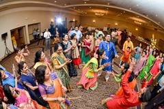 Indian pre-wedding guests celebrating garba dance. Indian pre-wedding guests celebrating garba dance.