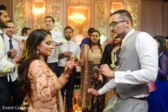 Adorable indian bride and groom showing some dance moves. Adorable indian bride and groom showing some dance moves.