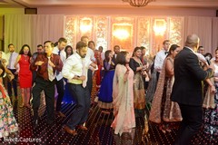 Indian wedding guests showing some dance moves. Indian wedding guests showing some dance moves.