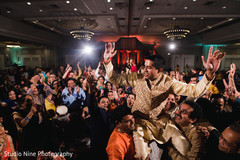 Indian groom being lifted by groomsmen at sangeet. Indian groom being lifted by groomsmen at sangeet.