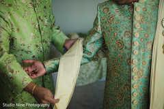 Enchanting groom getting ready for wedding ceremony.