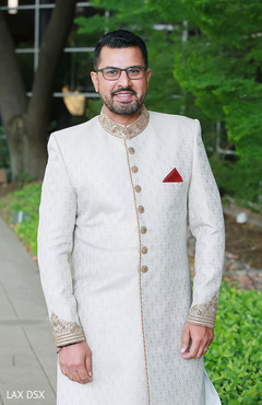 Indian groom looking at the camera during pictures Indian groom looking at the camera during pictures