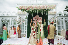Indian bride and groom throw rice behind them. Indian bride and groom throw rice behind them.