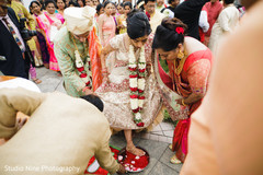 Indian bride steps in red paint ritual. Indian bride steps in red paint ritual.