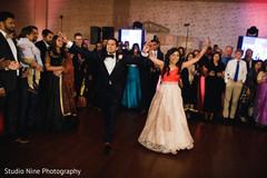 Indian newlyweds making their entrance to wedding reception Indian newlyweds making their entrance to wedding reception