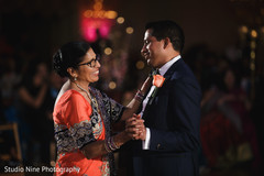 Indian groom dancing with his mother capture Indian groom dancing with his mother capture