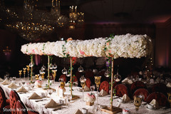 Majestic Indian wedding reception long table flowers decor. Majestic Indian wedding reception long table flowers decor.
