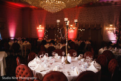Elegant Indian wedding golden candle chandelier table decoration. Elegant Indian wedding golden candle chandelier table decoration.