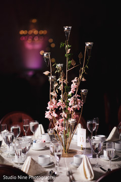 Delightful Indian wedding reception table centerpiece decor. Delightful Indian wedding reception table centerpiece decor.