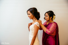 Indian bride being assisted by special guest Indian bride being assisted by special guest